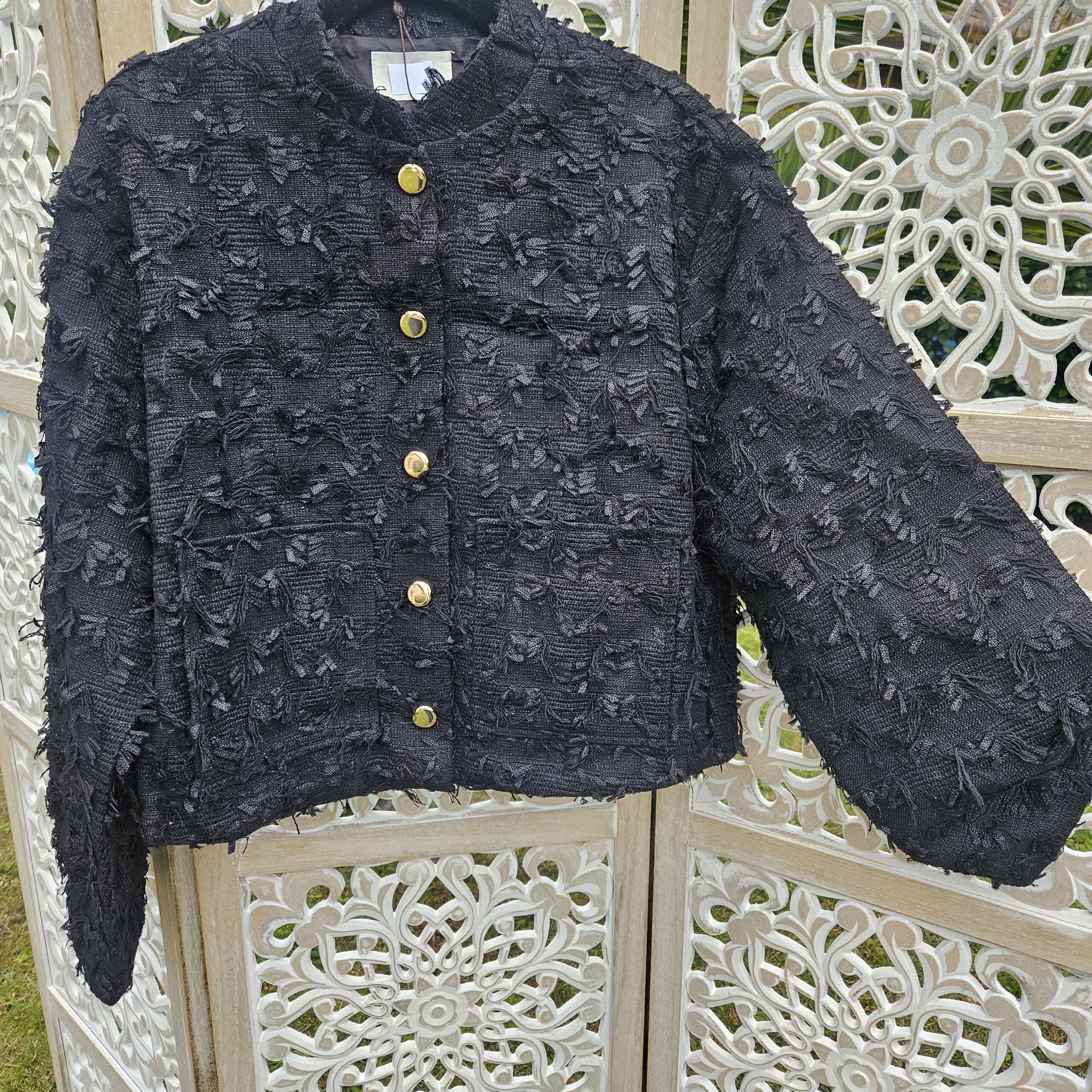 Veste courte noire en tweed